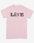 Pink t-shirt with 'LOVE' text and teddy bear graphic on a white background