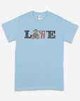 Light blue t-shirt with 'LOVE' text featuring a teddy bear and stars on a white background