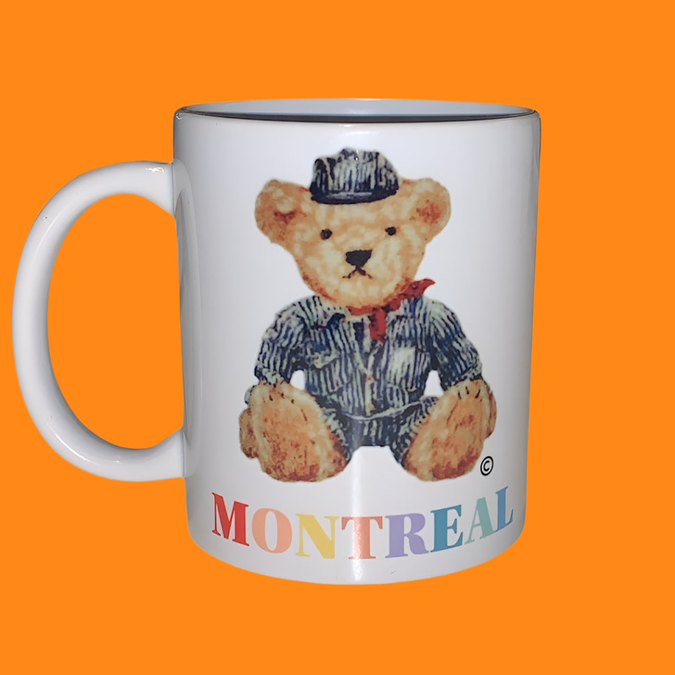 Mug with a teddy bear design and 'Montreal' text on a white background
