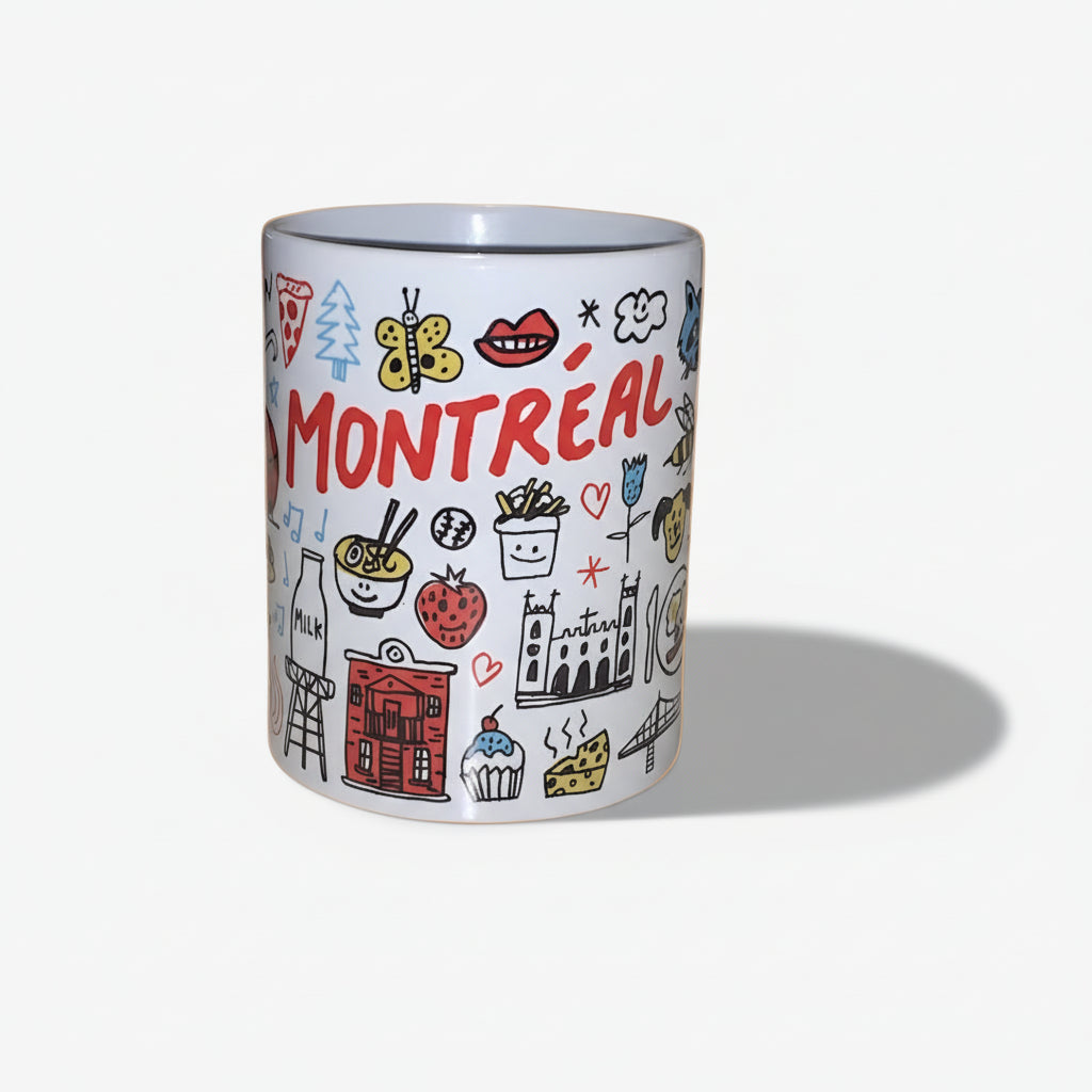 Ceramic mug with 'Montreal' and various icons on a white background